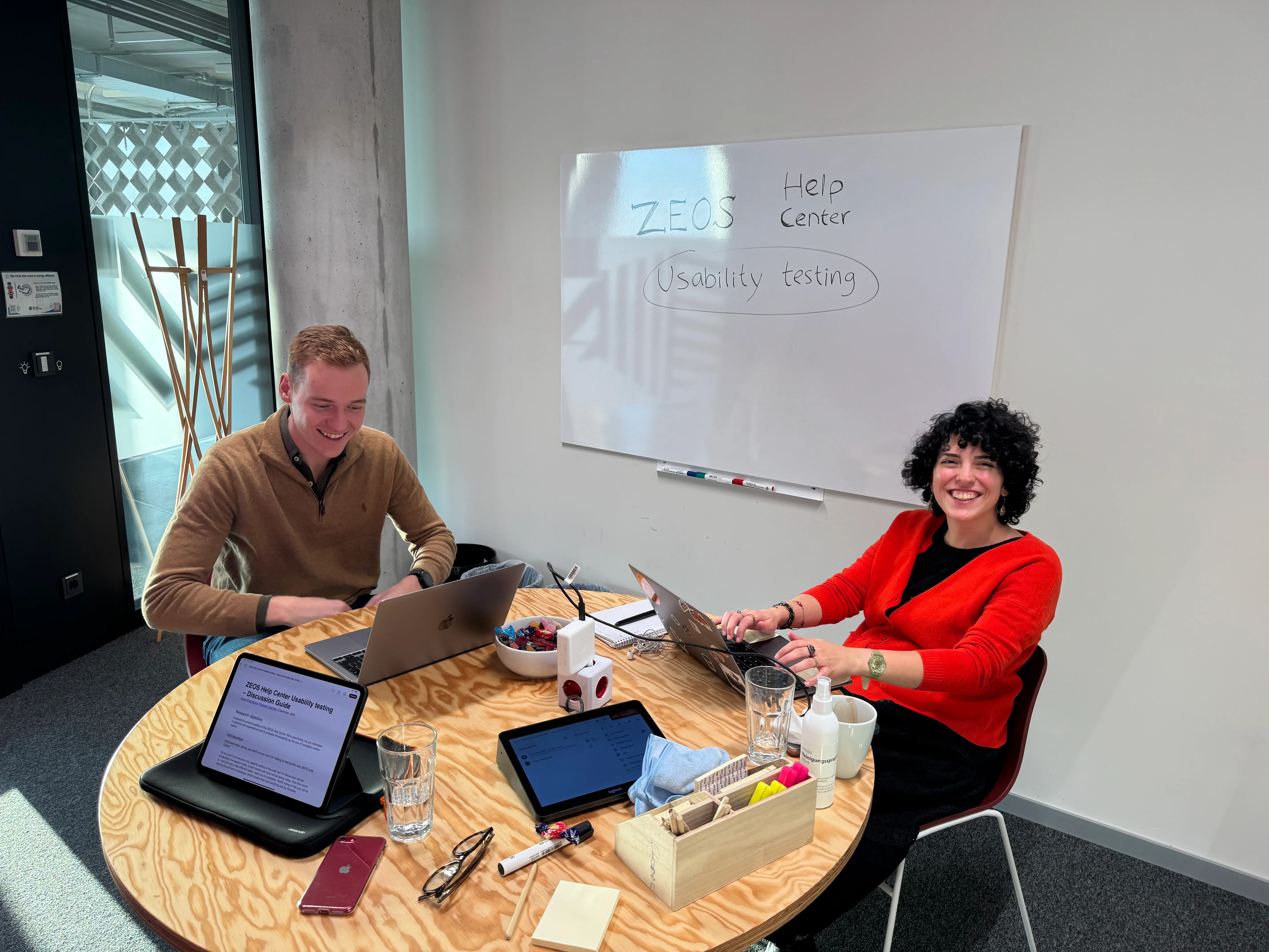 Usability testing with two participants in an office room.
